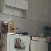 کابینت و سینک به همراه شیرآب وتعدادی وسایل خانه