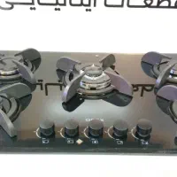 آشپزخانه ای مدرن با هود گاز وسینک هماهنگ