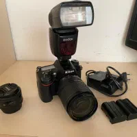 دوعدد رم ۶۴ سان دیسک و فلشر دوربین نیکون با شارژر