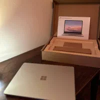 لپتاپ مایکروسافت مدل 1 Surface Go با کارتون