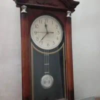 ساعت دیواری چوبی مدل ستونی صفحه سفید عقربه دار