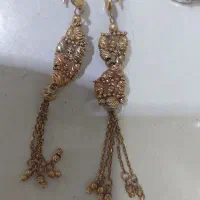 گوشواره دوریکا صدتومن بالای تابلو