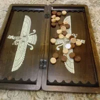 یک عدد ساعت مچی ویک عدد تخته نر نو و تمیز