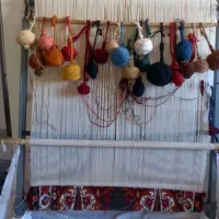 فرش نصفه بافته شده