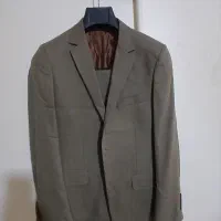 تعدادی کت شلوار پارچه مطهری در سایزهای مختلف