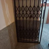 درب چوبی دولنگه به همراه کرکره آکاردونی