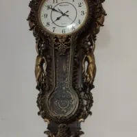 ساعت دیواری آونگ دار