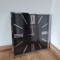 ساعت دیواری  دور استیل  زمینه مشکی  کاملا  نو