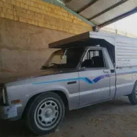 راننده با ماشین مزدا یا آریسان