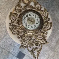 ساعت و میز و لوستر و مجسمه برنجی