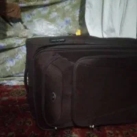 چمدان برزنت چرخ دارکره ای نو که دسته درداخل