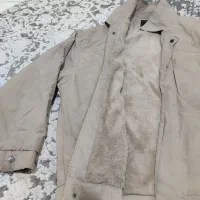 تعدادی کاپشن کار|لباس|قم, قلعه کامکار|دیوار