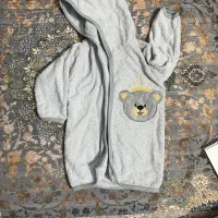 حوله نوزاد|کفش و لباس بچه|مسجد سلیمان, |دیوار