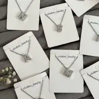 گردنبند حروف نگین دار سوارسکی حراجی