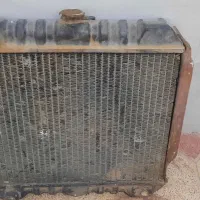 رادیاتور ‌و‌یک جفت لاستیک نیسانی