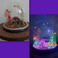 دکوری گنبد شیشه‌ای با نور LED و دسته گل های ربانی