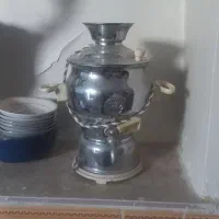 سماورگازی بزرگ وسماوردکوری کوچک برقی وساعت وقوری