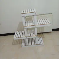 تخت اپلاسیون و گلدان ایستاده|آرایشگاه و سالنهای زیبایی|کرج, شهرک یاس جنوبی|دیوار