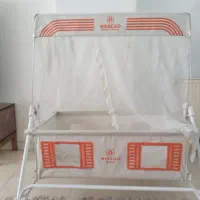 گهواره کنار تخت مادر
