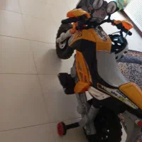 متور اسباب‌ بازی کودک به همراه کلاه ایمنی|اسباب‌‌بازی|فولادشهر, A4|دیوار