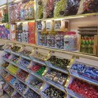 مغازه سوپر قفسه چای قنادی ویترین آجیل شکلات عطاری