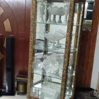 ست ویترین و لوستر و ساعت طرح برنج