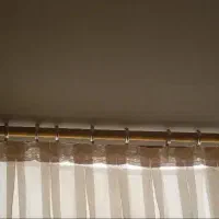 چوب پرده طلایی۴متر باتمام‌حلقه‌هاوگیره‌هاش