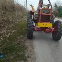 فروش تراکتور با بیل بکهو و تیغه جلو