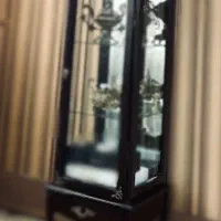 بوفه و ساعت دیواری قهوه ای سوخته