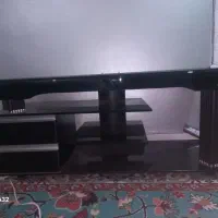 میز تلوزیون در حد نو تمام شیشه دو کشاب شرکتی