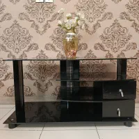 میز تلویزیون شیشه‌ای دو کشو - مثل نو - فقط۳ میلیون