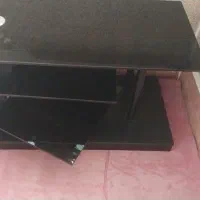 میز زیر تلویزیون شیشه ای