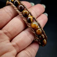 دستبند چشم ببر بافته شده با چرم مرغوب