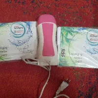 دستگاه اپیلاسیون به همراه دو بسته پد