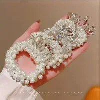 کش مو مرواریدی تاج دار،بچه گانه