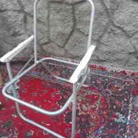 صندلی تاشو آلومینیومی وتلفن قدیمی رومیزی