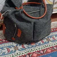 ساک لباس نوزاد وپشه بند