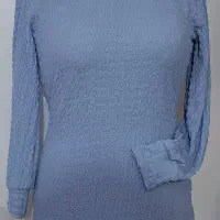 دوزنده در کارگاه خیاطی