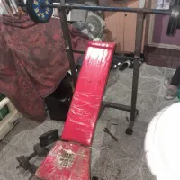 نیمکت بدنسازی همراه با هالتر و وزنه