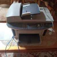 یک دستگاه چاپگر چهار کاره اچ پی