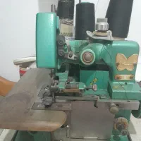 سردوز پروانه با میز بزرگ و نخ مشکی و سفید