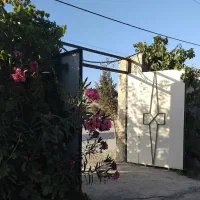 باغ-در-محمدشهر-تهاتر-با-واحد-مسکونی-و-ماشین
