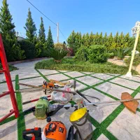 علف تراشی برش درخت هرس درخت و گل