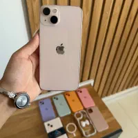 ایفون۱۳صورتی iPhone 13 pink همراه با ۷قاب اشانتیون