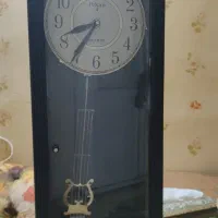 ساعت دیواری پاندول دار کشابدار