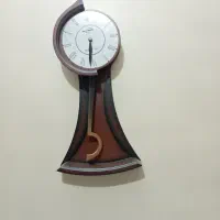 ساعت دیواری پاندول دار جنس چوب مرغوب