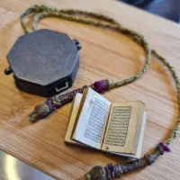 قرآن کوچک چاپ سنگی و جعبه نقره دوره قاجار