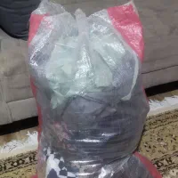 یه کیسه مانتو و لباس همش باهم