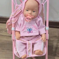 عروسک با کالسکه