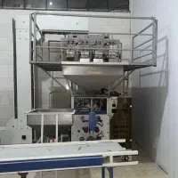 دستگاه بسته بندی چهار توزین با بالابر Z